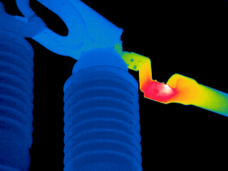 a thermal image of an electrical connection glowing red hot