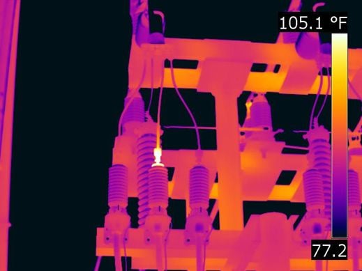 a thermal image of a electrical connection glowing red hot
